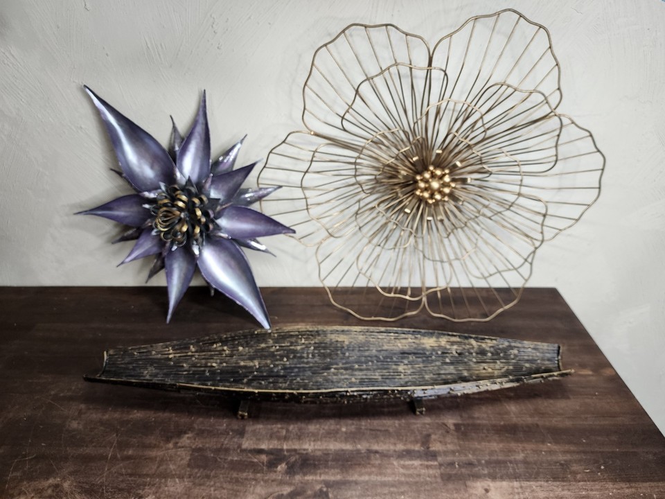 A genuine mid-century modern wire fruit basket paired with wall art — the kind of sculptural, functional combo that looks like it escaped a 1960s design catalog.