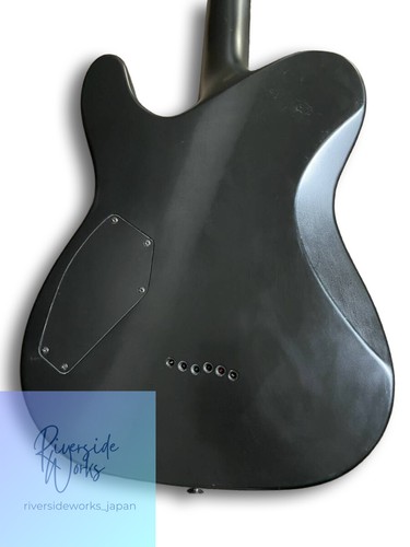 Black Schecter Blackjack SLS PT 2012 model with silver hardware, rounded back, and visible Riverside Works, Japan, text.
