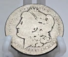 1889 O MORGAN SILVER DOLLAR. Obviously has been in many cowboy's pockets