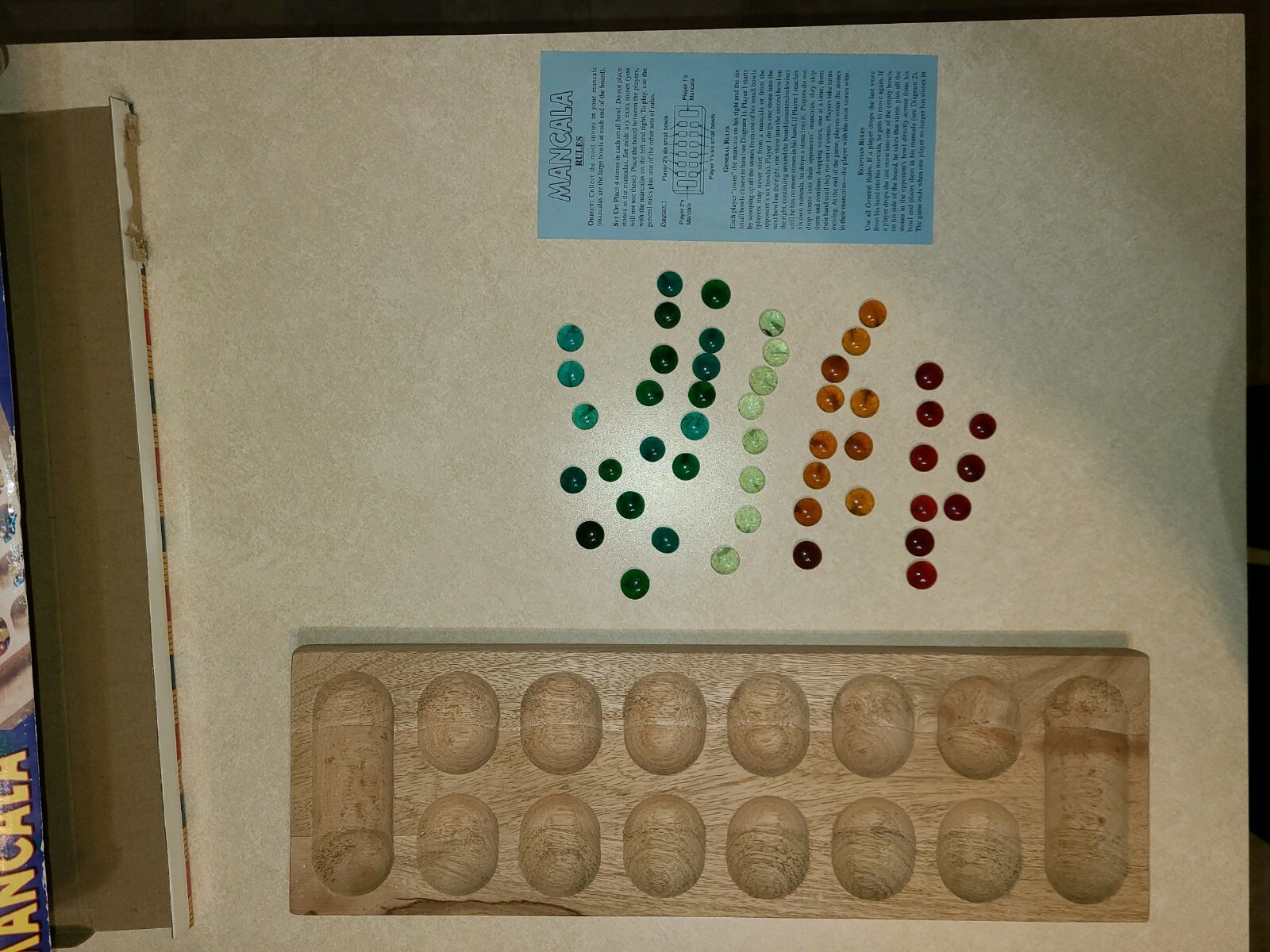 Mancala Game - Solid Wood Board and Gemstone Pieces by University Games