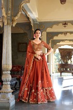 Designer Rust Orange Silk Lehenga Choli with Heavy Golden Embroidery  Dupatta