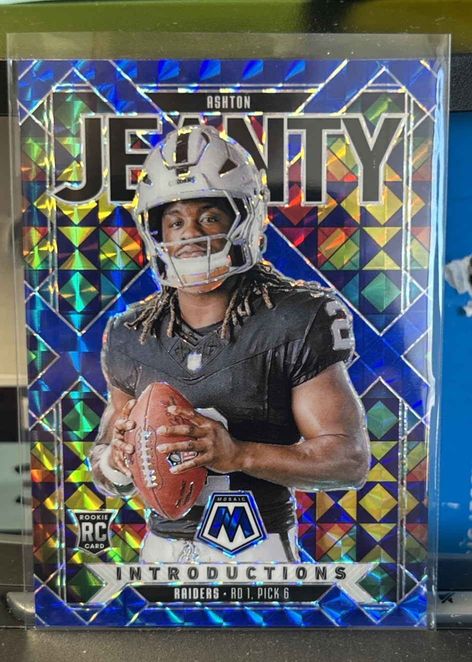 2025 Panini Mosaic Ashton Jeanty Introductions Blue Prizm 57/99 RC #3 Raiders