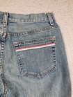 Blue Karen Kane Lifestyle jeans back pocket with pink and red stripe detail and “USA Made” text on waistband.