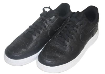 black nike shoes with white soles