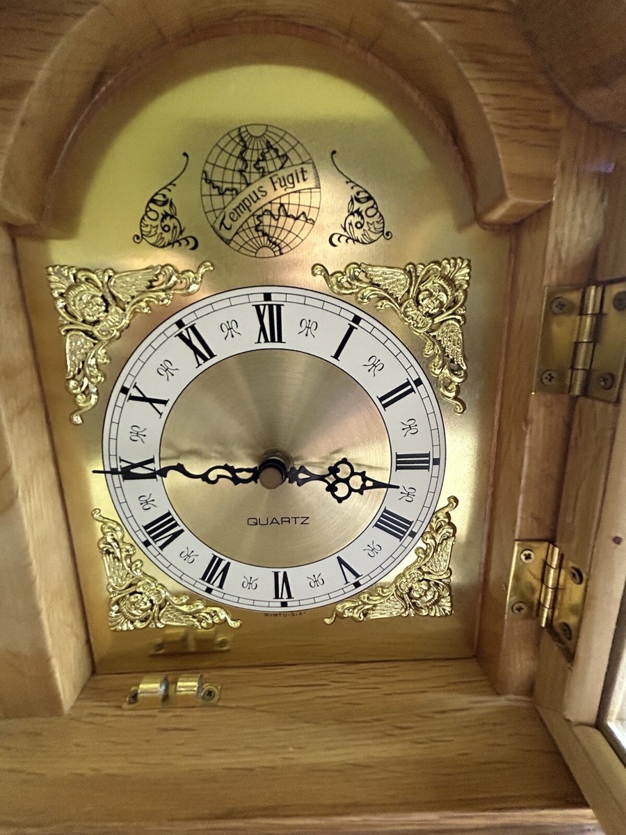 Tempus Fugit Mantle Clock Quartz Movement Gold Tone Oak Exterior