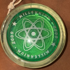 Used Millennium 2000 High Performance Yo-Yo.  Clear Green With Atom Symbol.