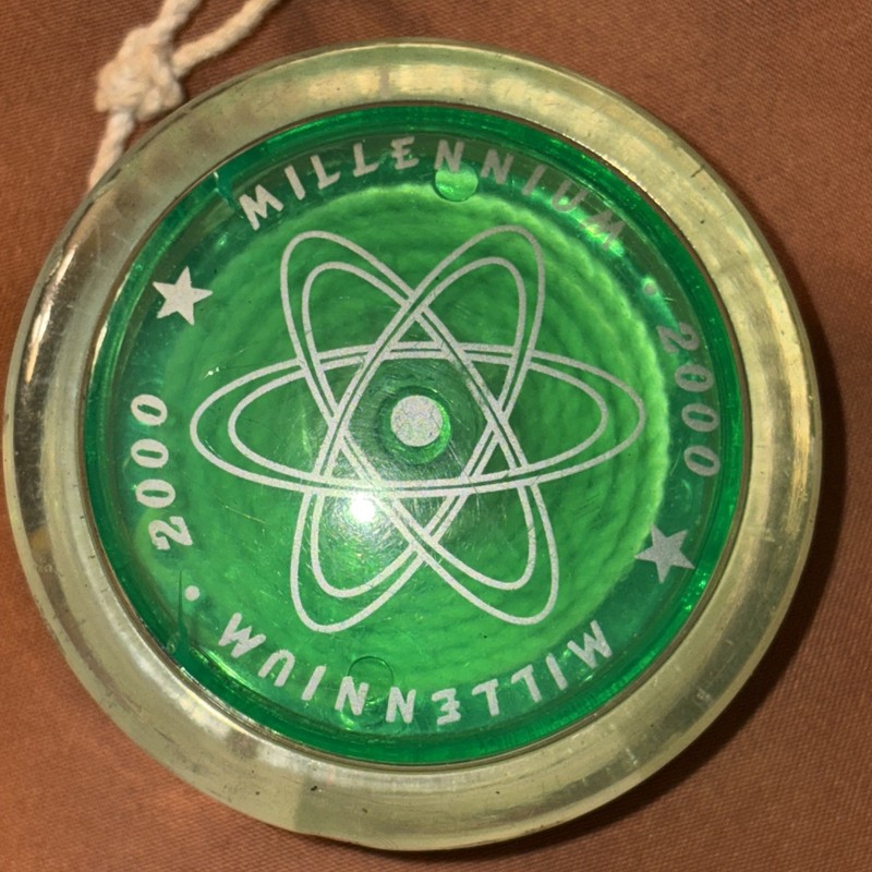 Used Millennium 2000 High Performance Yo-Yo.  Clear Green With Atom Symbol.