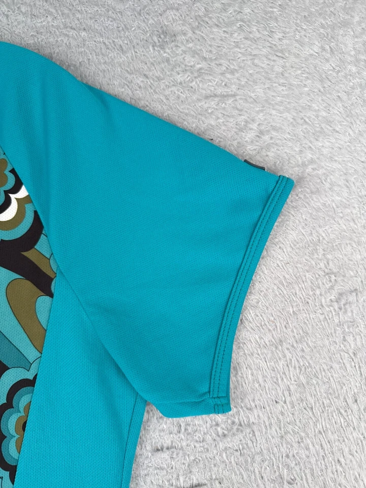 Jersey de ciclismo Shebeest para mujer grande azul azulado estilo años 70 floral 1/2 cremallera poliéster Foto 2 de 4