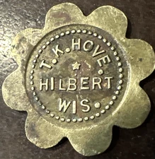 TOKEN  Hilbert, Wisconsin  T.K. HOVE  GOOD FOR 5¢ IN TRADE