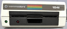 Commodore VIC-1540/41 Drive tested works w/book,T Ddisk,cords,shipcard, 8 disks