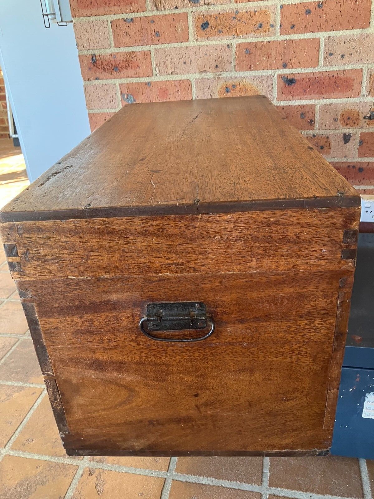 antique wooden storage chest or blanket box, with metal handles and