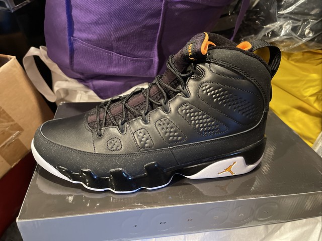 black and yellow jordan 9