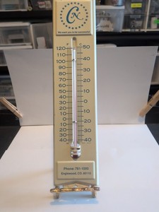 vintage outdoor metal thermometer