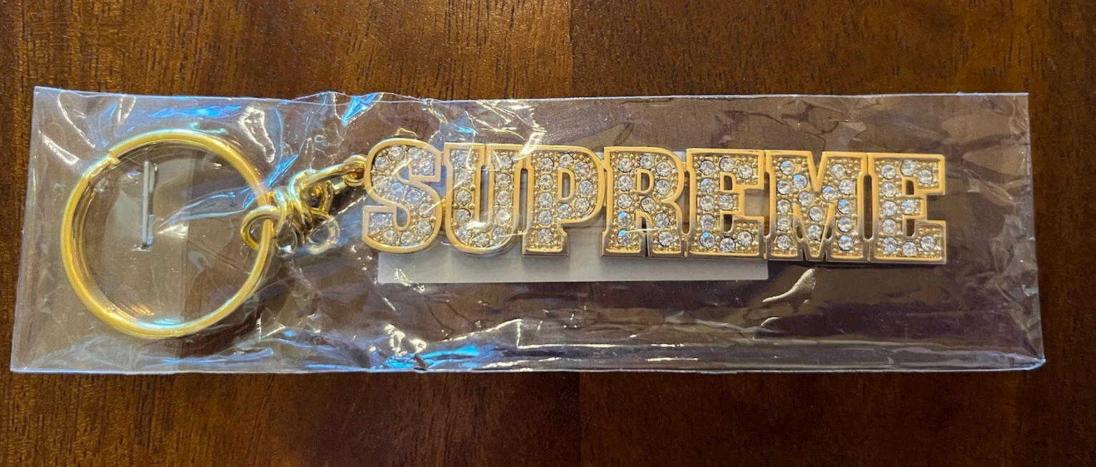 NEUF DANS SON EMBALLAGE D'ORIGINE   PORTE CLÉS LOGO BLOC D'OR SUPRÊME BLING SS18