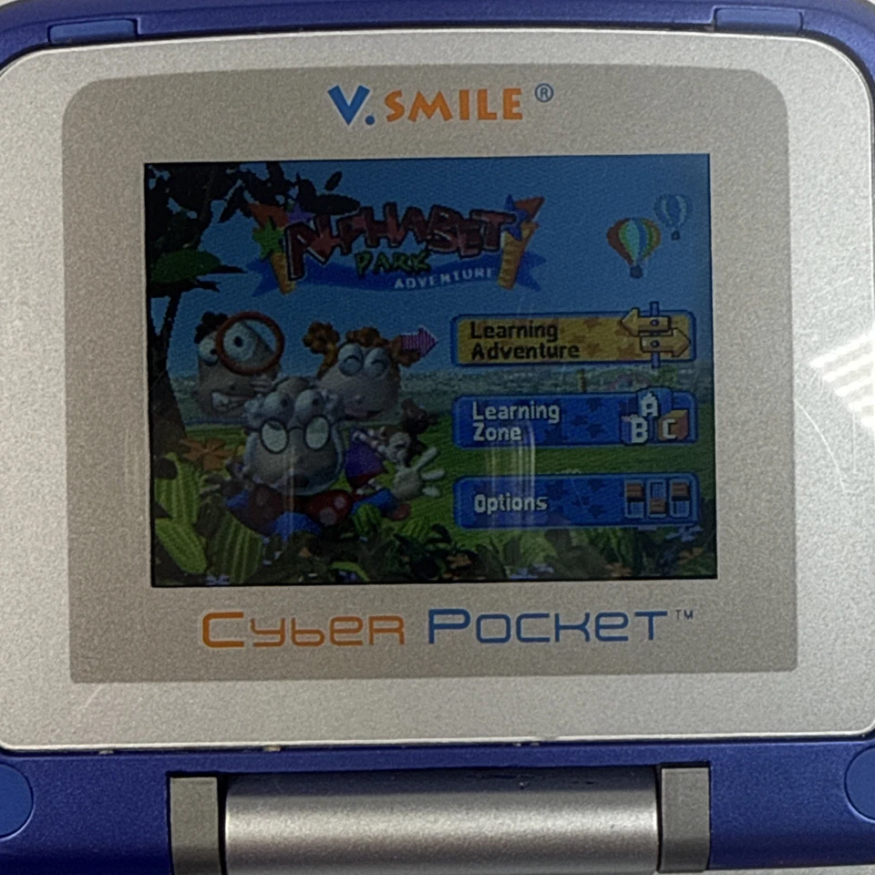 Sistema de aprendizaje VSmile Vtech Cyber Pocket probado incluye 2 juegos y adaptador de CA Foto 3 de 4