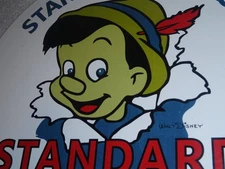 VINTAGE STANDARD GASOLINE PINOCCHIO WALT DISNEY 11 3/4" PORCELAIN METAL OIL SIGN