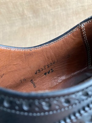 Alden 942 Medallion Tip Blucher is built on the Aberdeen last. The model has a black Calfskin leather upper with a single leather outsole.