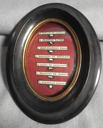 ANTIQUE FRAME WITH THE RELICS OF 7 JESUIT SAINTS -