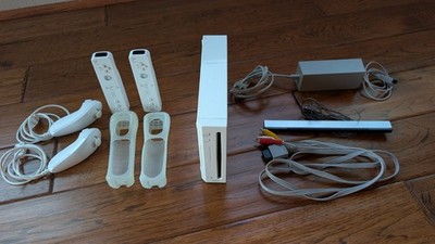 Nintendo Wii Console With Remotes, Nunchucks, Power Supply, AV Cable, Sensor Bar