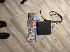 PlayStation 4  - Black comes with games and also 2 controllers And cords