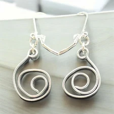 Hand bent 2" silver spiral earrings