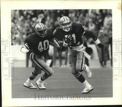 #ad #ad 1987 Press Photo Apple Bowl Husky safety Eugene Burkhalter versus Cougars $24.99