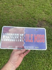 NOS SEALED MISSISSIPPI STATE OLE MISS HOUSE DIVIDED BOOSTER LICENSE PLATE TAG