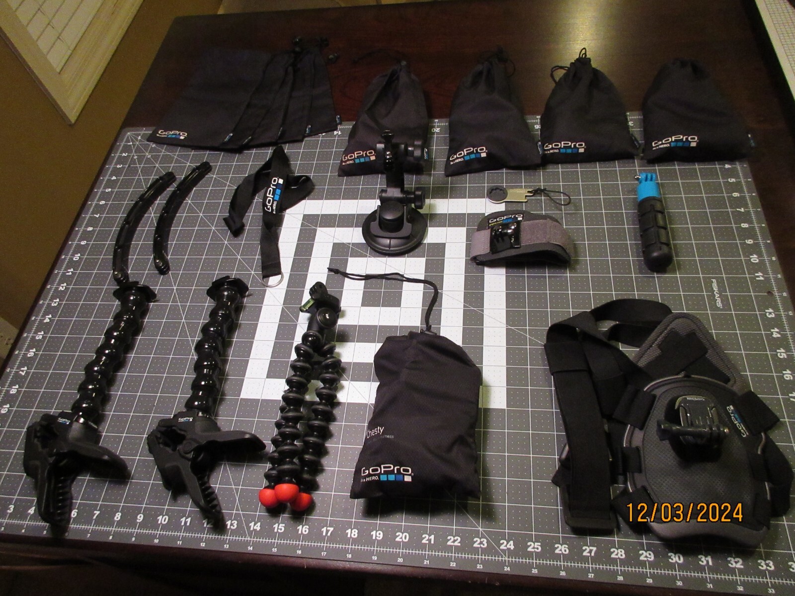 Lot of GoPro Accessories mounts, clamps, harnesses, storage bags-image