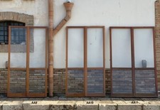 porte Finestre per balcone in legno massello a due ante con vetri