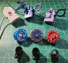 3 Beyblades with launchers and assembly tools / Lot 2