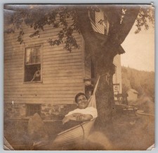 Vtg B&W Snapshot Smiling Man Relaxing In Hammock By House Shade Tree 1940s