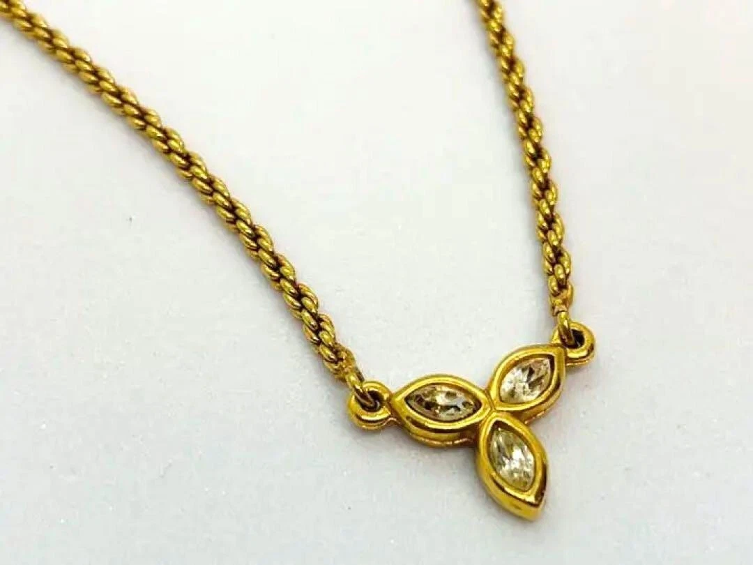Collier Christian Dior doré motif fleur breloque chaîne accessoire femme bijou
