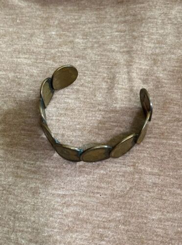 Brazalete hecho de centavos C80-18