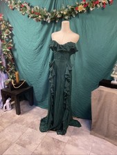 Elegant Green Ruffle Evening Gown flowing design with delicate ruffles.