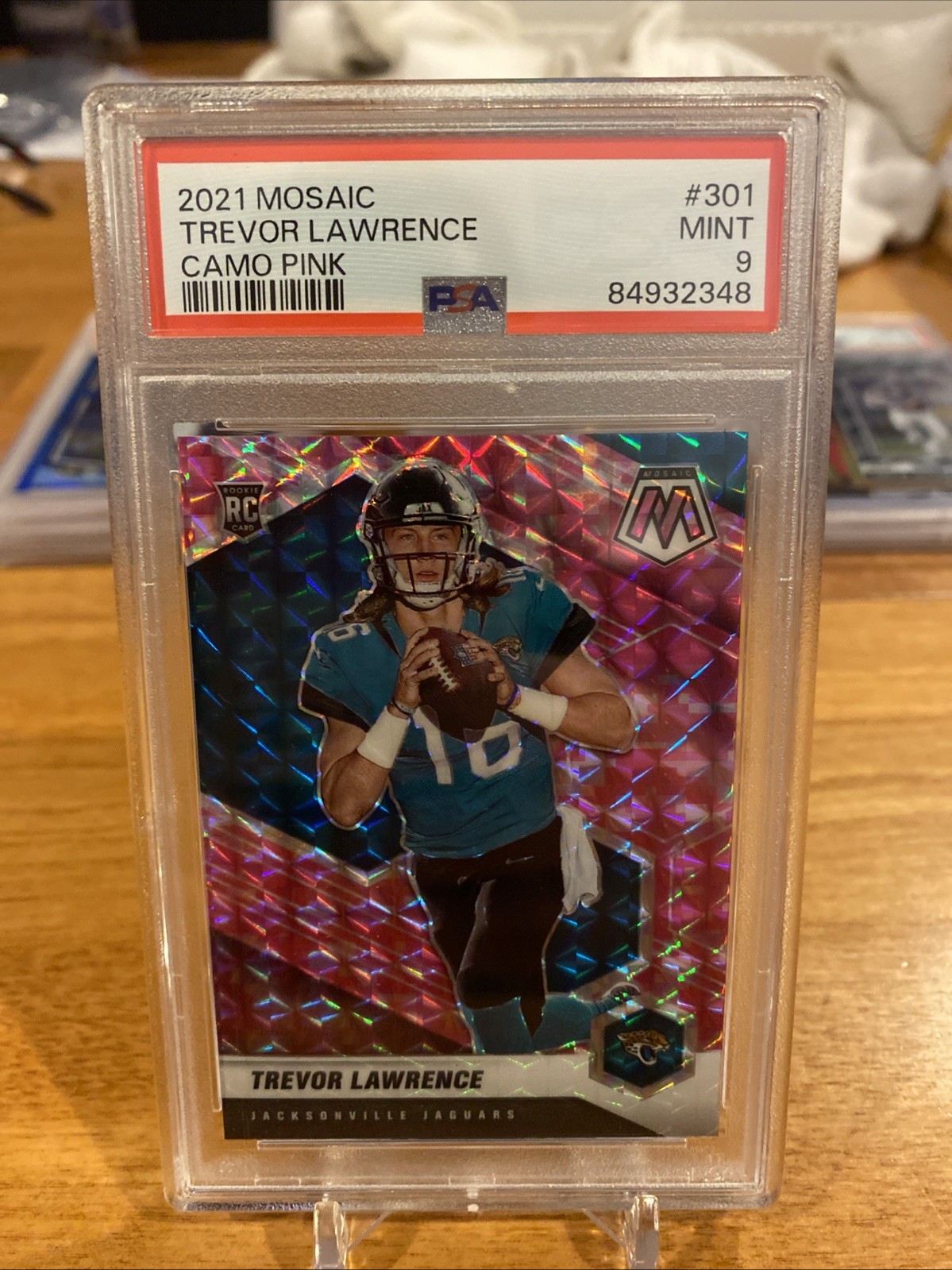 2021 Panini Mosaic - Rookies Trevor Lawrence #301 Camo Pink Mosaic Prizm (RC)