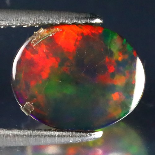 1.59 ct Superb Oval Cabochon (10 x 8 mm) Ethiopian Flashing Black Opal - Picture 2 of 2
