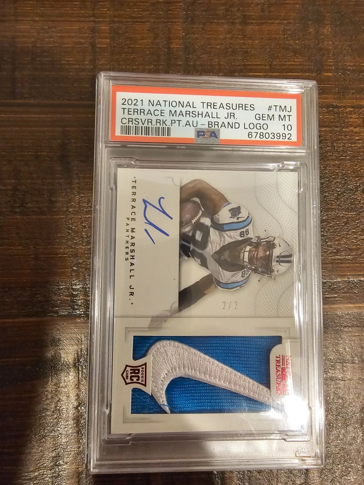 Terrace Marshall Jr. Panini National Treasures Crossover Rookie Patch Autographs #TMJ Brand Logo