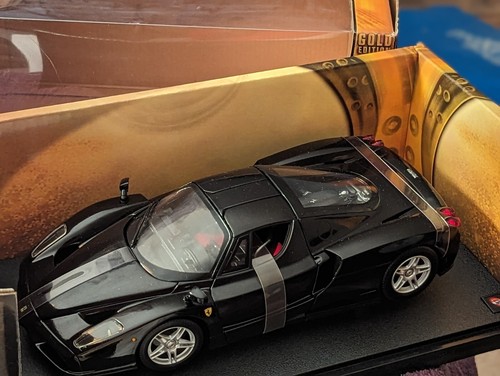 CRISP LINES 1:18 SCALE FERRARI ENZO GOLD PURE BLACK NIOB W/ SHIPPING HARNESSES - Picture 13 of 24