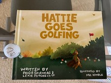 PAIGE SPIRANAC SIGNED Golf ball and Children’s Book: “Hattie Goes Golfing”