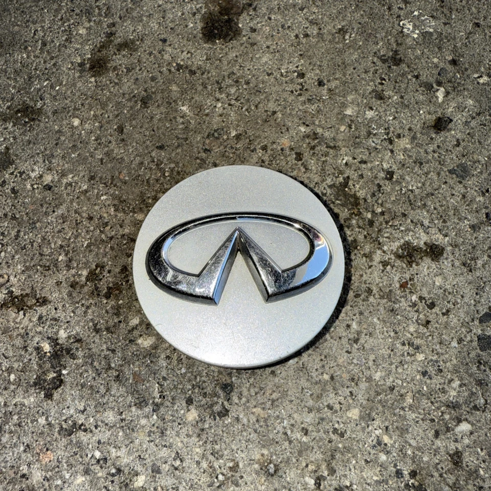 Tapa central OEM Infiniti G35 Q45 I30 G20 M45 1998-2015 40342-AU510 Foto 2 de 4