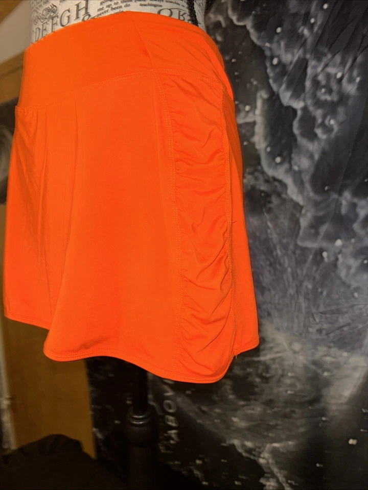 Falda corta de secado rápido de rendimiento de capa 8 Skort pequeño bolsillo oculto Foto 3 de 4