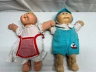 USED - Set of 2 Cabbage Patch Dolls with a pile of extra clothes