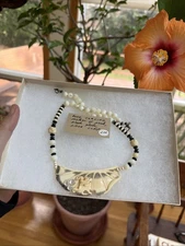 Handcrafted Pearl and Bead Necklace with Unique Pendant