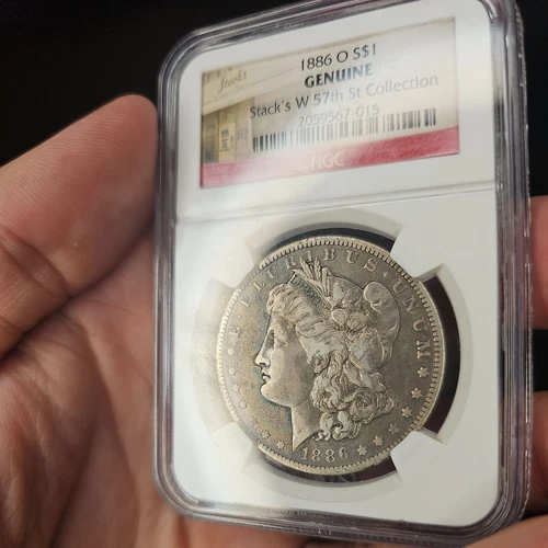 1886-O Morgan Silver Dollar $1, LIGHT RAINBOW TONING NGC Genuine,  Stacks toned