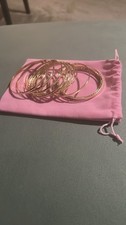 Enhance your style with this elegant gold bangle set. Perfect for any occasion 