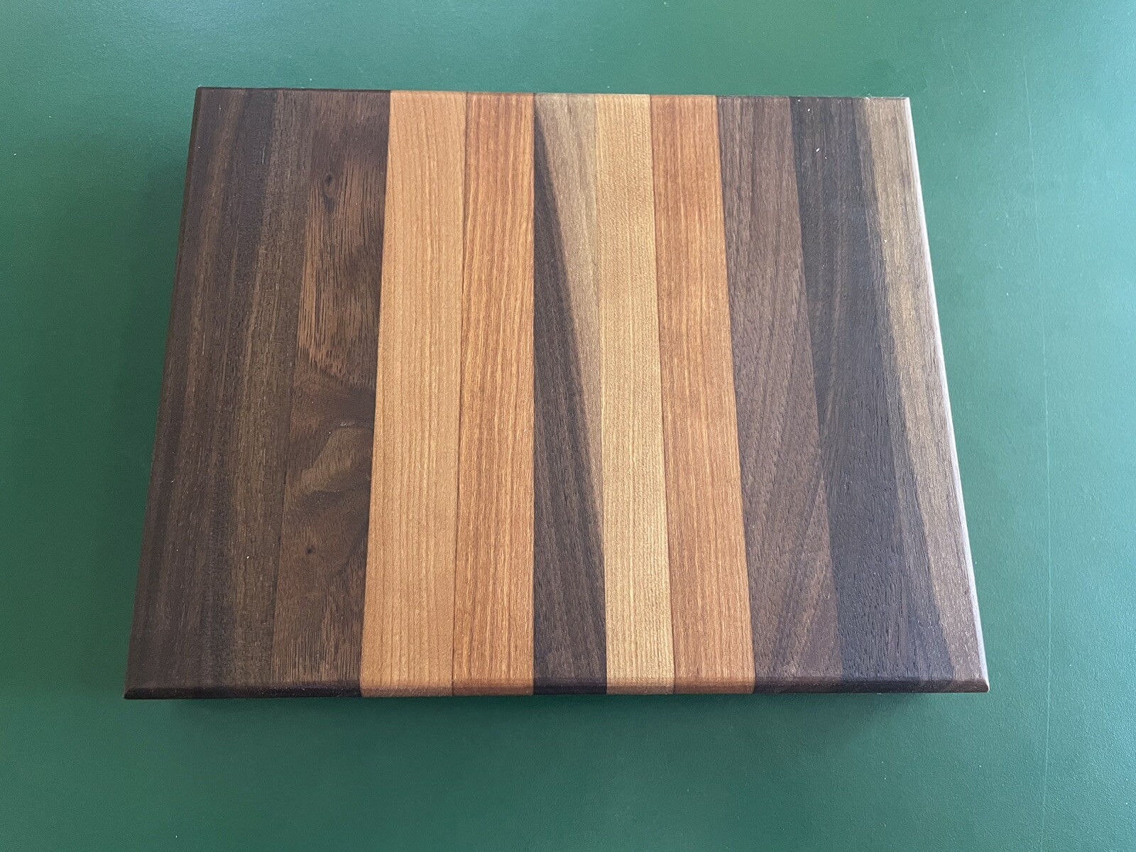 Walnut and cherry wood edge grain cutting board. 7”x9”x 1.5” thick, Handmade