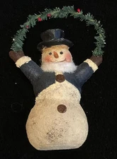 Primitive Style Snowman Holding Christmas Greenery