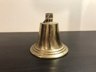 Ornamental collectible brass colored metal bell
