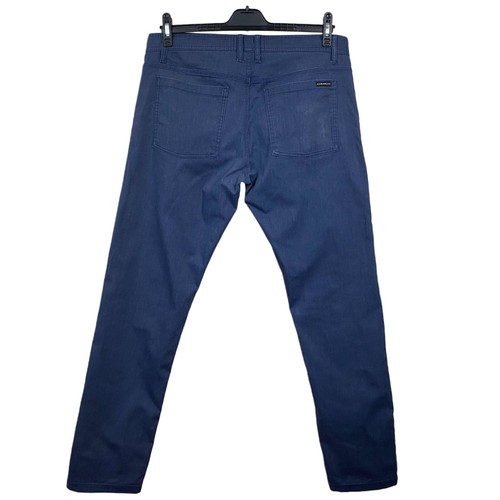 JEANS OAKLEY ALGODÓN ELÁSTICO AZUL MARINO GOLF ATLETISMO. TALLA W34xL32 - Imagen 2 de 4