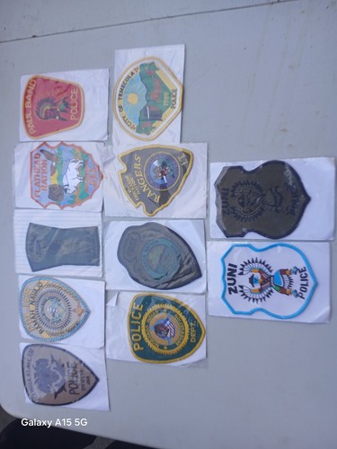 large indian tribal police sew on patches